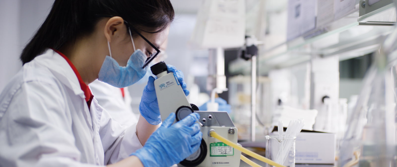 INKBANK chemical engineers testing custom inkjet ink formulation in a high-tech R&D laboratory