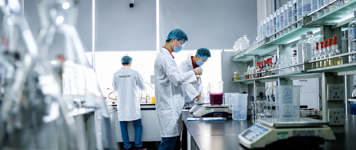 NKBANK real R&D laboratory with technicians testing ink formulations