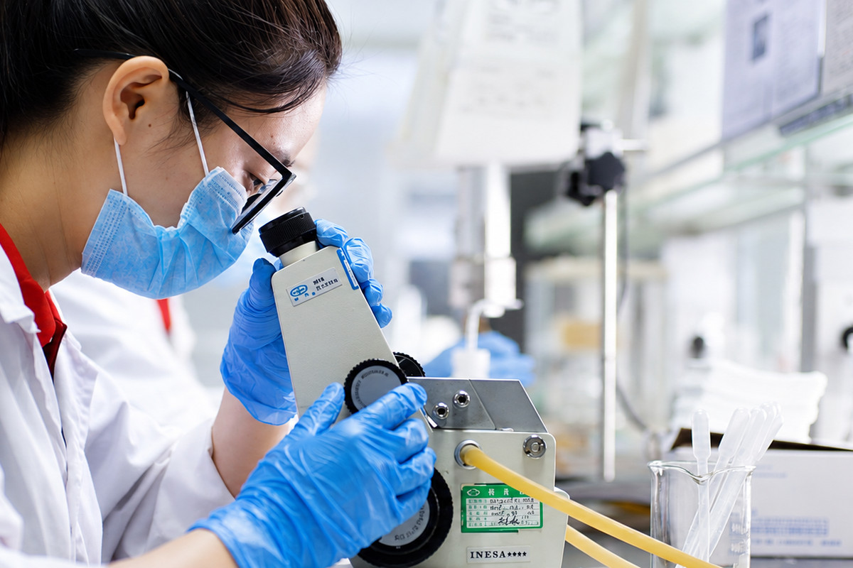 INKBANK technician testing ink quality in the laboratory
